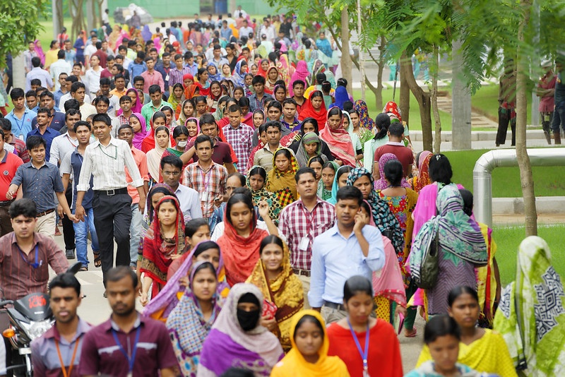 Bangladeshi garment employees leaving a clothing plant at the end of their working day. Credit: Crozet M. / ILO