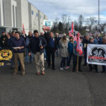 General Electric workers from Canada and the USA protest outside the annual shareholders' meeting, near Pittsburgh.