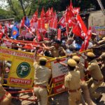 Police clash with striking workers in Chennai