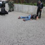 Injured workers are assisted by their colleagues