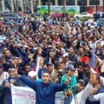 Maghreb Steel workers at a sit in protest outside a bank