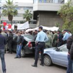 Maghreb Steel workers at a sit in protest outside a bank
