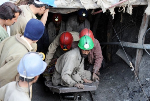 Workers enter a mine in Orakzai, Pakistan