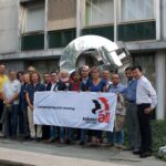 STMicroelectronics union representatives in front of the International Solidarity sculpture at IndustriALL's Geneva headquarters