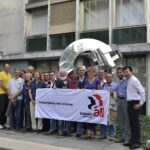 STMicroelectronics union representatives in front of the International Solidarity sculpture at IndustriALL's Geneva headquarters