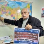 Miembros de la Unión de Trabajadores Mineros y Metalúrgicos de Rusia con un cartel de solidaridad