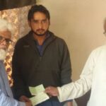 Bashir Mehmoodani, President, Shipbreaking Mazdoor Union handing over compensation cheques to the deceased workers’ families