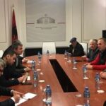 Union members meet with government officials and the employer on 28 December