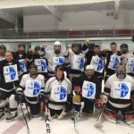 The local hockey team shows its support for the locked out workers. Photo: USW