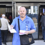 Union activists gave out flyers to shareholders