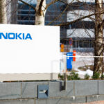 Nokia company name on white board next to Nokia head quarter entrance in Espoo, Finland, Credit: Risto H (Shutterstock)