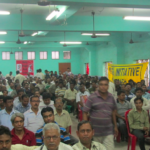 Workers at the Paharpur cooling towers