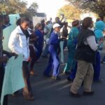 The tannery workers are striking to get transport to work.
