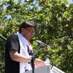 Kemal Özkan adresses demonstrators in Madrid