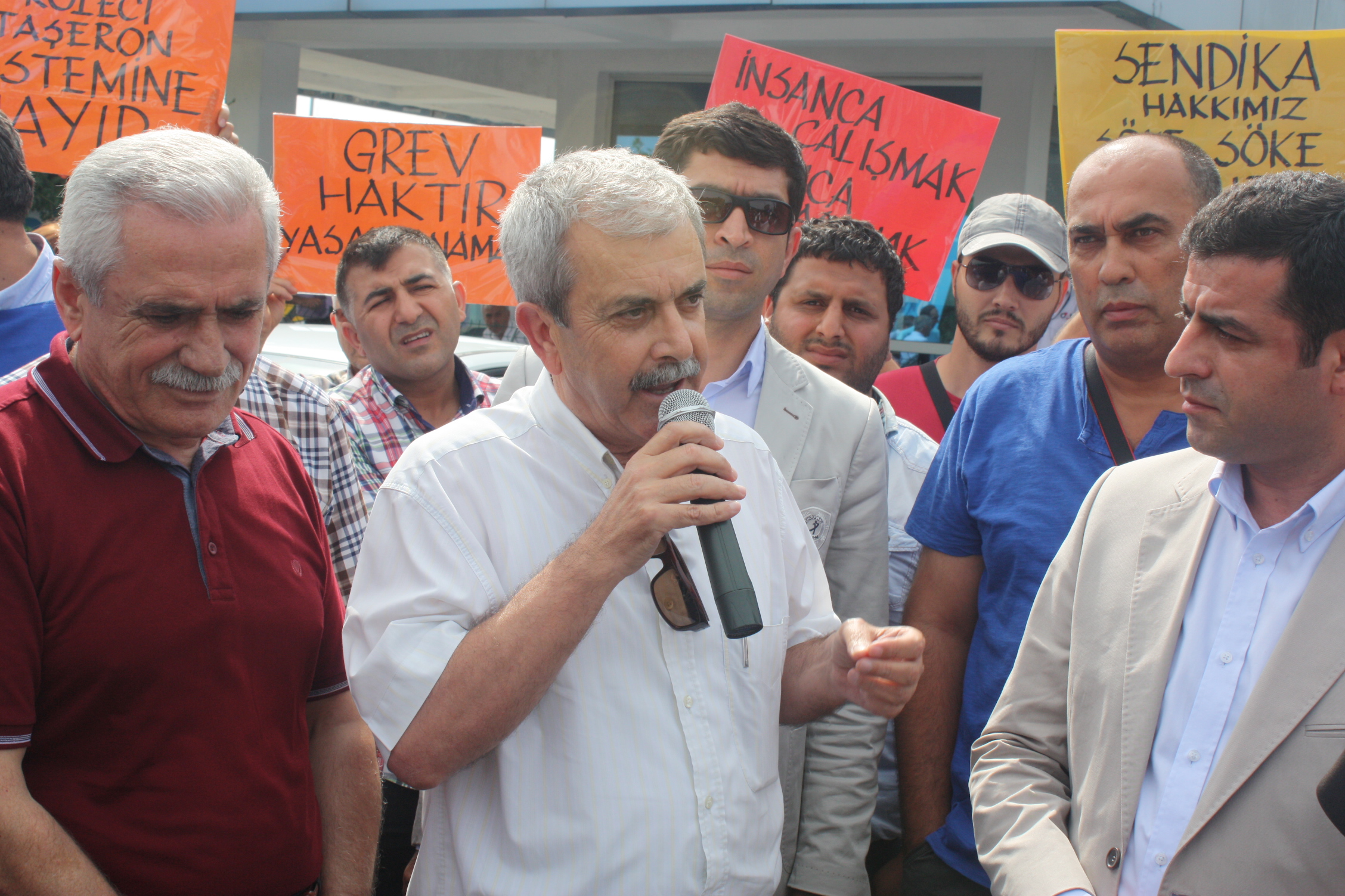 Mr. Selahattin Demirtaş, one of three presidential candidates, joining protestors outside the plant gate. 
